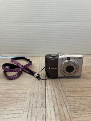 RARE Canon PowerShot A1000 IS Camera 10MP Digital Purple 4X Zoom Image Stabilize - Image 1 of 4