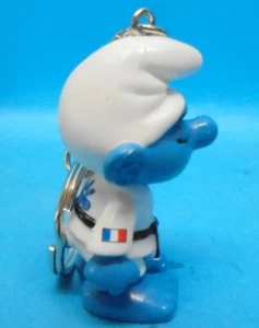 JUDO Schlumpf ABILIS Aufdruck Werbung promo pub Schlüsselanhänger Schleich - Bild 1 von 4
