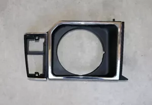 LH HEADLAMP DOOR CHROME BLACK.85-91 MITSUBISHI MONTERO (87-89 DODGE RAIDER) - Picture 1 of 2