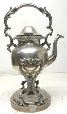 Soporte calentador tetera plateado sobre cobre Foto 1 de 4