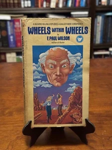 WHEELS WITHIN WHEELS by F. Paul Wilson (1ST DELL PRINTING - 1979) PB - Picture 1 of 4