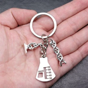 10 Sets Tibetisches Silber Charms Mikroskop Zählbecher GLÜCK Schlüsselanhänger zum Selbermachen X10088 - Bild 1 von 3