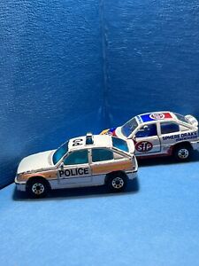 (2)Vintage Matchbox 1985 Vauxhall Astra GTE STP Rally Car And Police Car.