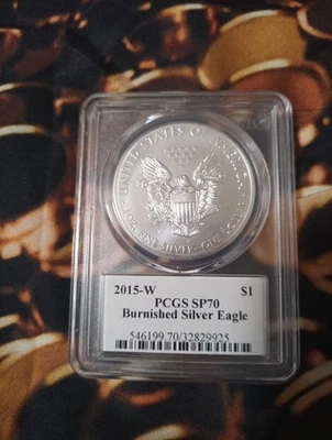 2015-W BURNISHED SILVER EAGLE PCGS SP70 JOHN MERCANTI SIGNED FLAG LABEL EA132 - Image 1 of 2