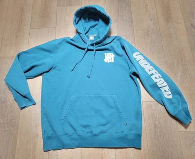 Undefeated 5 Strike Logo ICON Hoodie Sweatshirt Teal Blue Mens Size XL Spellout - Image 1 of 4