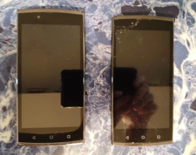 For parts or not working Lot of 2 UMX Smartphones Sold As Is - Image 1 of 4