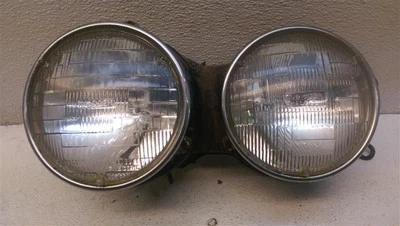 Pair of Drivers Left Headlights w/Bracket & Grill for 83-84 BMW 733I  - Image 1 of 4