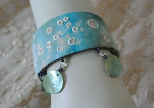 Hand Crafted and Painted Leather Cuff with Mother of Pearl Shell accent Fringe. - Picture 1 of 6