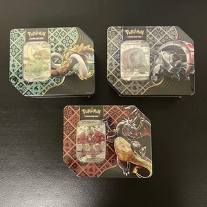 Pokemon Paldean Fates Latas [Juego de 3] SHINY CHARIZARD, TUSK, PISADAS NFS - Imagen 1 de 2