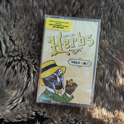 MF Doom METAL FINGERS PRESENTS: SPECIAL HERBS VOL. 1 & 2 New Mustard Cassette - Image 1 of 2