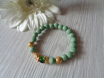 Flexibles  Armband LAVA-Perlen glatt hellgrün gold - Bild 1 von 2