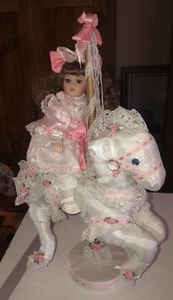 PORCELAIN DOLL ON CAROUSEL HORSE W/ RIBBONS & FLOWERS BEAUTIFUL SIZE 17.5" X 11" - Picture 1 of 12