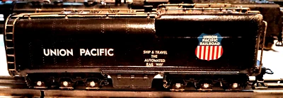 NICE LOOKING DIECAST SCRATCH BUILT THREE RAIL 12 WHEEL TENDER IN GOOD COND. - Image 1 of 4