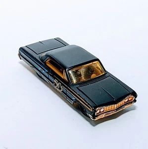 Hot Wheels flat black ’64 Impala, with Anniversary decoration along the side. It - Picture 1 of 5