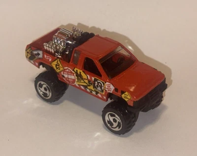 Camión Nissan suelto Hot Wheels (versión naranja) Foto 1 de 2