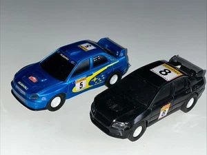 Markenlose Slot Cars Rallye Subaru Impreza Mitsubishi Evo Arbeitsscheinwerfer 1:43 ? - Bild 1 von 10