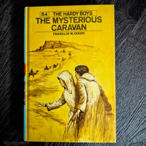54 The Mysterious Caravan (1975): Vintage Hardy Boys Book Blue-Back - Imagen 1 de 4