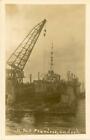 REAL PHOTOGRAPHIC POSTCARD OF HMS FEARLESS WARSHIP IN FLOATING DOCK