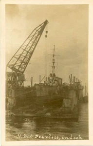 REAL PHOTOGRAPHIC POSTCARD OF HMS FEARLESS WARSHIP IN FLOATING DOCK - Picture 1 of 2