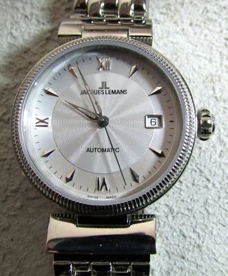 JACQUES LEMANS ACERO INOXIDABLE 1-890 AUTOMÁTICO SKELTON FECHA INVERSA RELOJ CAJA Y PAPELES Foto 1 de 4