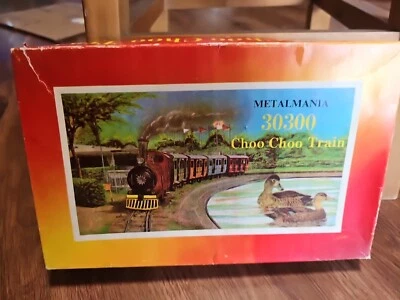 Tren de cuerda litográfica de hojalata Metalmania vintage y pista de safari en caja original, funciona Foto 1 de 4