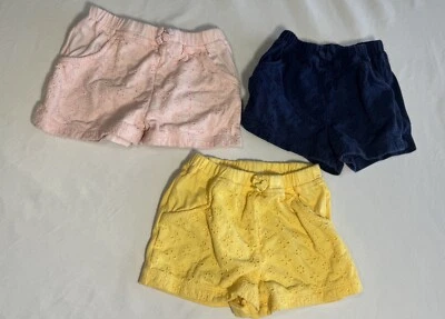 First Impressions Set de 3 Pantalones Cortos Pull On Ojales Azul Amarillo Rosa Niñas 24 Mos Foto 1 de 4