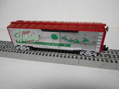 LIONEL 2123100-H CHRISTMAS LIGHT EXPRESS HAPPY HOLIDAYS SOUND BOXCAR COLORED LED - Image 1 of 4