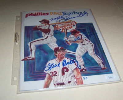 JSA COA MIKE SCHMIDT S CARLTON PETE ROSE signed AUTOGRAPH  82 PHILLIES YEARBOOK - Image 1 of 2