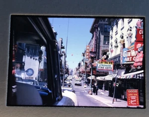 1960's China Town view from car of Street scene with vehicles    - Picture 1 of 3