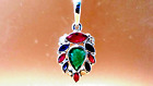 18kt.stamp w/gold pendant,with natural diamonds and emeralds,20"chain.