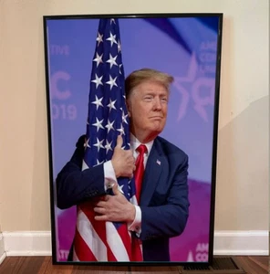DONALD TRUMP HUGGING AMERICAN FLAG GLOSSY 2024 POSTER - Picture 1 of 7