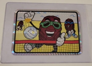 MÁQUINA EXPENDEDORA PRISMÁTICA DE VOLEIBOL CALIFORNIA RAISINS AÑOS 80 TARJETA ADHESIVA - Imagen 1 de 3