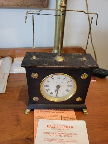 Horolovar Flying Pendulum Novelty Clock Working Cover