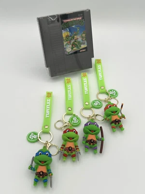 1989 TEENAGE MUTANT NINJA TURTLES (TMNT) VINTAGE (NES NINTENDO) + TMNT CHARMS - Image 1 of 4