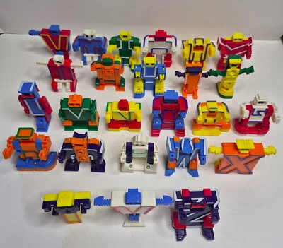 LOTE DE 25 robôs pré-escolares antigos anos 80 ALPHA BOTS alfabeto transformadores letras sem V - Imagem 1 de 4