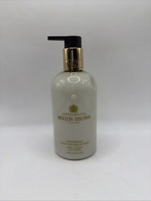 Hipnotizante Oudh Accord y Oro de Molton Brown para Unisex - Loción Corporal 10 OZ Foto 1 de 2
