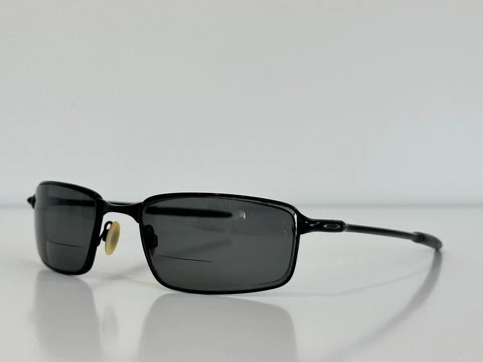 Gafas de sol Oakley 12-877 de alambre cuadrado negras para hombre 58-20 SOLO MARCO Foto 1 de 4