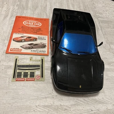 JUNK Kyosho 1/10 Ferrari Testarossa RC auto carrozzeria nera con adesivi... - Immagine 1 di 4