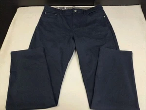 Pantalones de mezclilla tejidos elásticos ultraflexibles azules 36 #7460 IZOD calce regular para hombre nuevos con etiquetas - Imagen 1 de 9