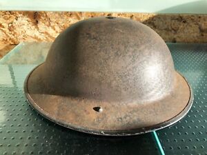 WW2 Brodie helmet. Origin not known. No markings on it. Complete with strap. 