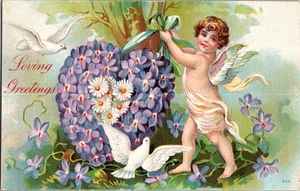 AK LIEBE GRÜSSE Cherub geblümt Herz geteilt hinten gestempelt 1910 - Bild 1 von 2
