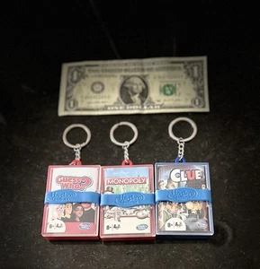 3 Schlüsselanhänger Spiele - Clue & Monopoly & Guess Who - Bild 1 von 10