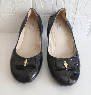 Zapatos mocasines planos sin cordones Cole Haan para mujer talla 8,5B charol negro Foto 1 de 4