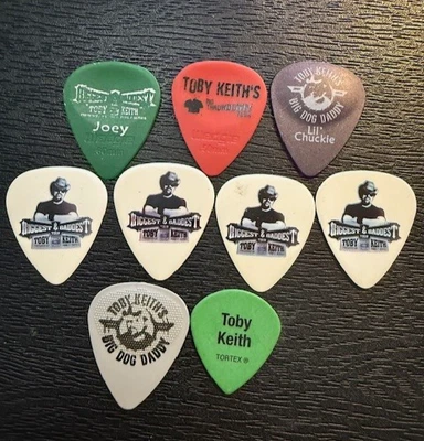 TOBY KEITH   /   LOT OF (9)  TOUR  GUITAR PICKS - Image 1 of 2