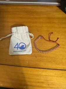 4Ocean Bracelet Flamingo Red Corded Clear Beaded Pull Closure With Bag New - Picture 1 of 3