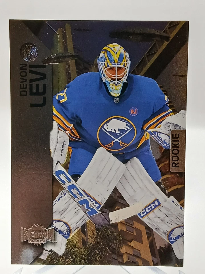 2023-24 SkyBox Metal Universe Hockey #194 Devon Levi Rookie – Buffalo Sabres RC! - Image 1 of 2
