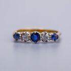 Solid 18K gold ring with row of platinum set sapphires and diamonds