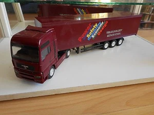 Conrad MAN TG A XXL "Trucknology Generation" in Dark Red on 1:50 - Picture 1 of 2