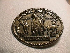 HESSTON NATIONAL FINALS 1982 BULL HORSE COWBOY WESTERN THEME BRASS BELT BUCKLE - Picture 1 of 2
