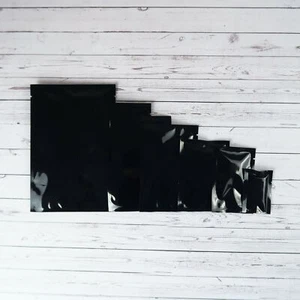 Paquetes de muestra de una sola porción Mylar negros sellables al calor tamaño abierto - Imagen 1 de 10